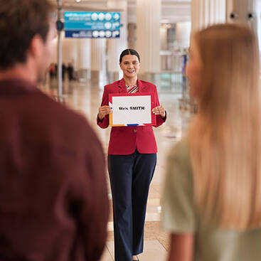 an Arabian Adventure representative picking up clients from the airport