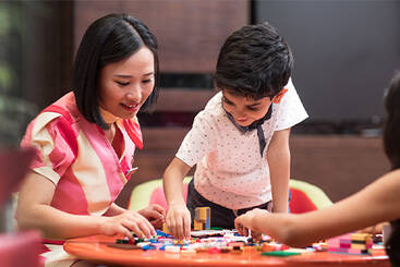 A marhaba representative playing with kids