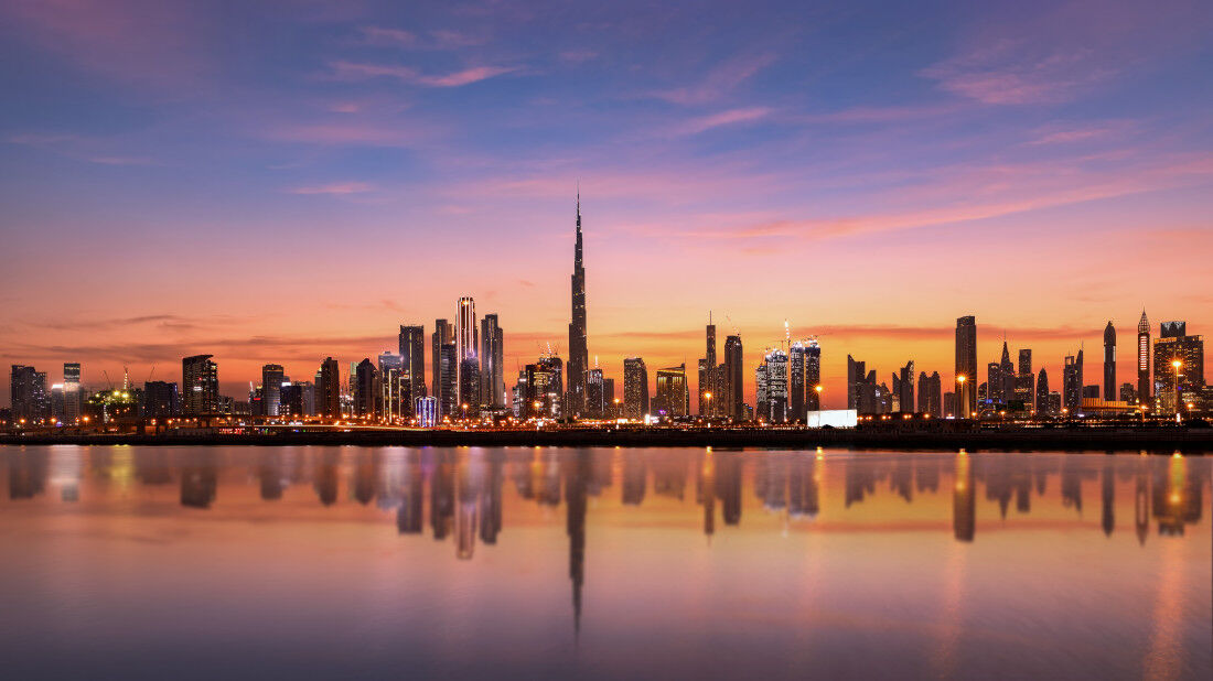 The Dubai skyline, featuring the Burj Khalifa, at sunset  