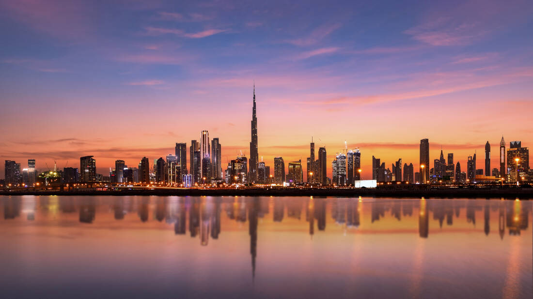 The Dubai skyline, featuring the Burj Khalifa, at sunset