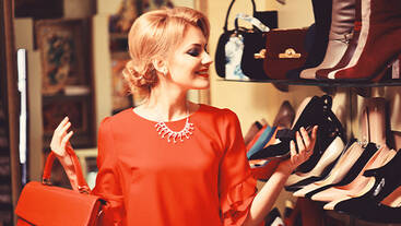 A woman shopping for shoes at a store