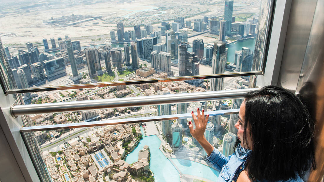 A woman looking at Dubai Fountain
