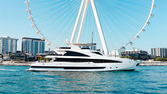 A yacht sailing against Ain Dubai