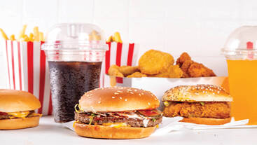 burgers, fries, nuggets and soft drinks