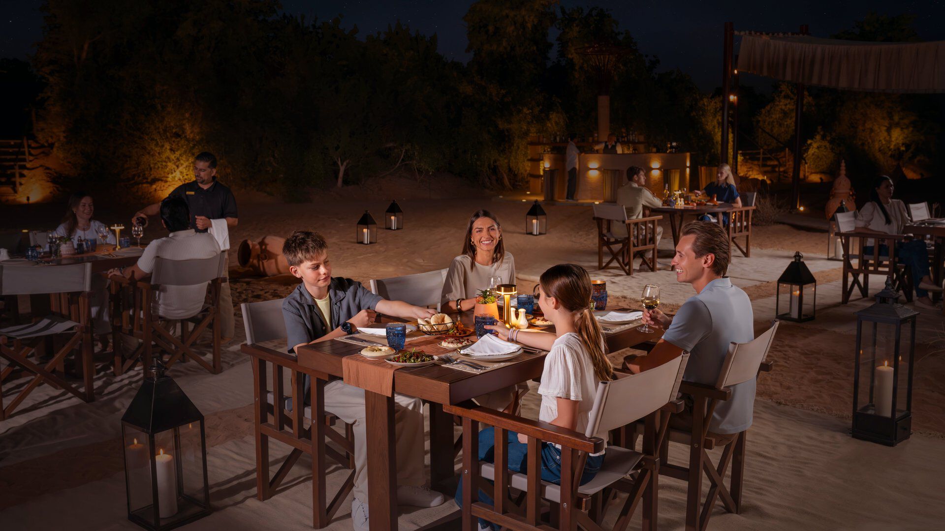 A family having dinner at the Nomad Garden