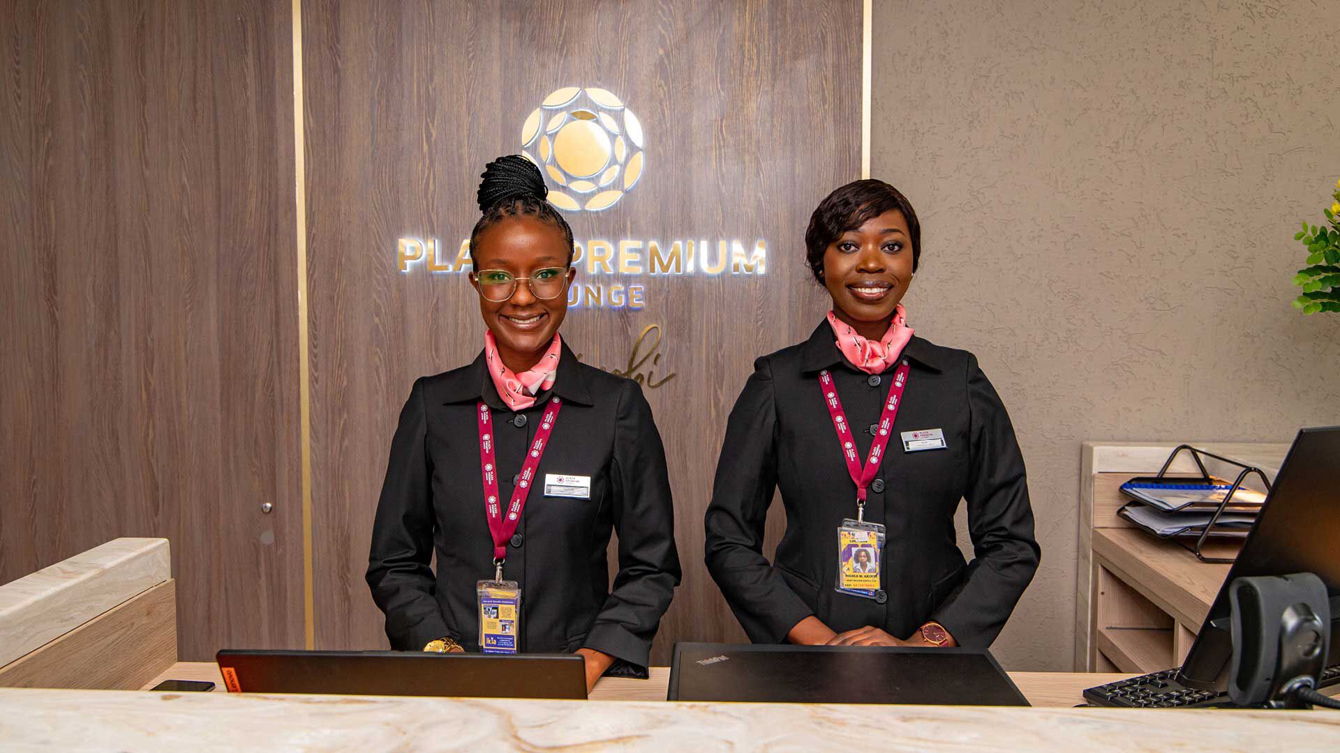 Two female front desk staff at Plaza Premium Lounge Nairobi Airport