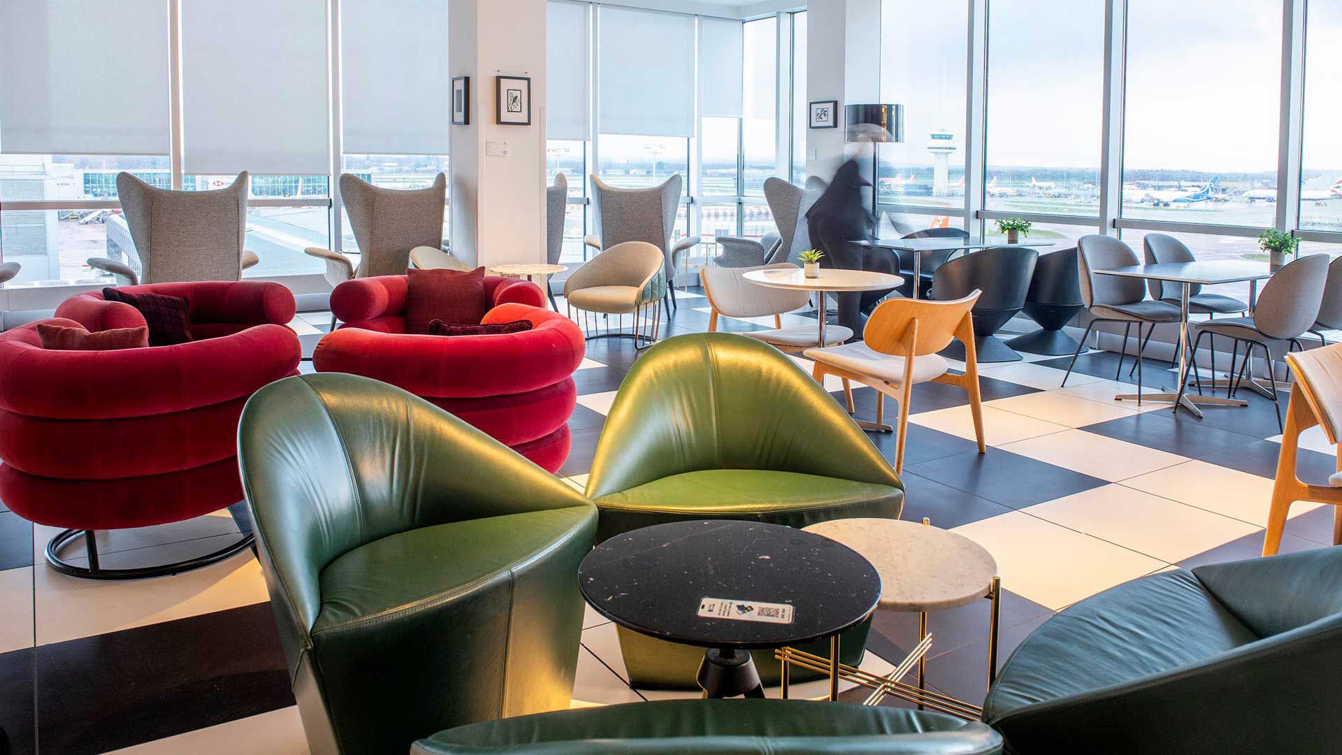 Interior of Plaza Premium Lounge London Gatwick Airport overlooking the airport's runway