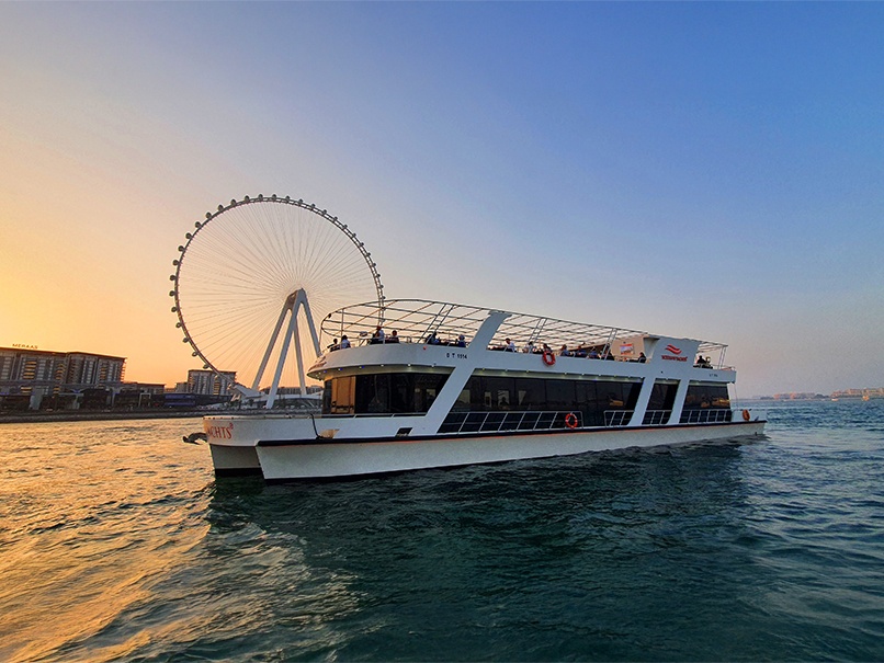 Desert safari A photograph showing a luxury yacht cruise at sunset