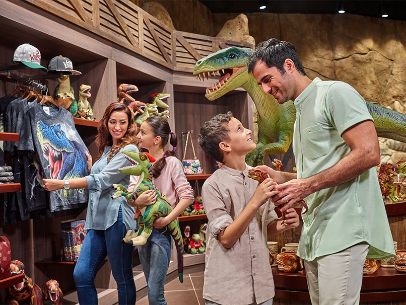 IMG Worlds of Adventure A photograph showing a family in a dinosaur-themed shop
